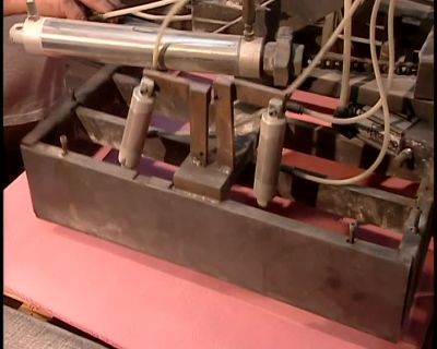 WHEN THE RUBBER'S READY,
THEY CUT OUT LARGE SQUARES, - How It's Made