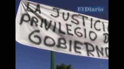 When she unfurled the banner, - The Three Deaths of Marisela Escobedo