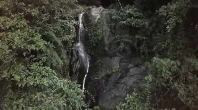 ‐ While exploring the waterfalls
beneath the carved gorilla face, - Lost Gold of World War II