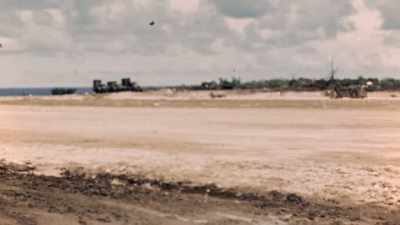 WHILE SMALLER PLANES NOW
COME AND GO FROM USHI POINT, - The Pacific War in Color
