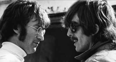 While they were waiting for the taxis,
John wrote, - The Beatles and India
