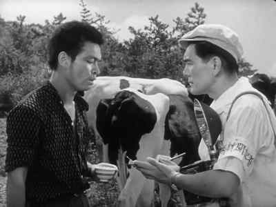 While various natives
of the island... - Godzilla: King of the Monsters!