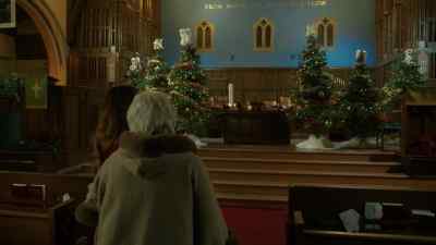 Whispering a message to an angel
on top of a tree - A Novel Christmas