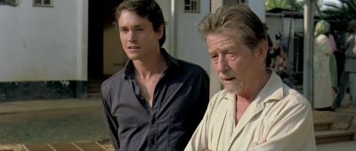White men coming in big car - Shooting Dogs