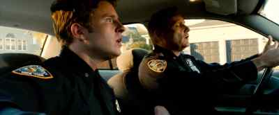 Why is he backing up? Why's
there a lawnmower on the trunk? - Kick Ass 2