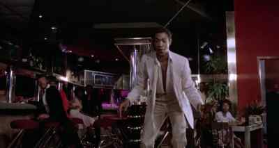 - Williams drives
down the court. - Disco Godfather