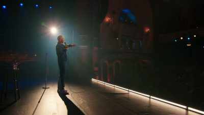 With a giant Canadian flag
hanging off the back. - Bill Burr: Drop Dead Years