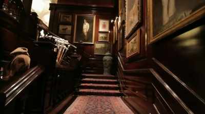 With a grand staircase, Oriental carpet. - Very Ralph