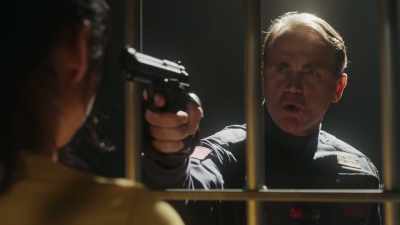 With a gun - The Purge