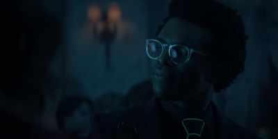 With a hidden ear piece
to direct-line into his boss - Batwoman