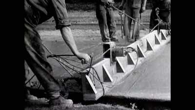 With her back against walls not yet built, - The Buildings That Fought Hitler