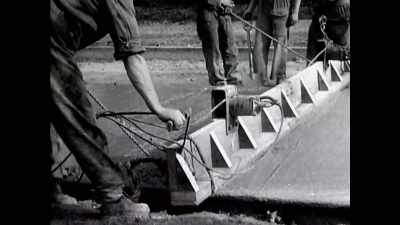With her back against walls not yet built, - The Buildings That Fought Hitler
