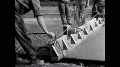With her back against walls not yet built, - The Buildings That Fought Hitler