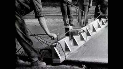 With her back against walls not yet built, - The Buildings That Fought Hitler