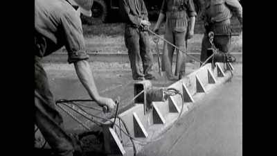 With her back against walls not yet built, - The Buildings That Fought Hitler