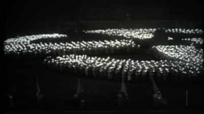 With swastikas,
marching people in uniforms, - How to Become a Tyrant