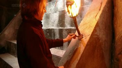 With the torches lit
the heat on set is rising. - Doctor Who Confidential