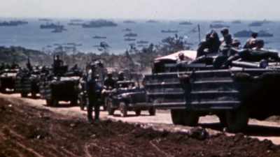 Within hours,
thousands of men unload - The Pacific War in Color
