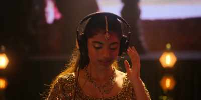 - [woman singing in Hindi] - Spin