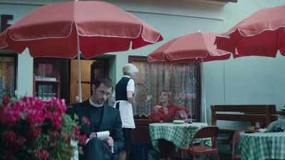 [Woman speaking German] - The Little Drummer Girl
