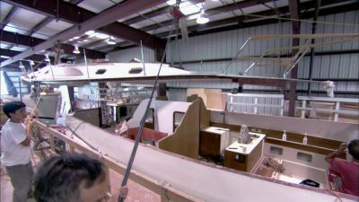 Workers carefully line
everything up. - How It's Made