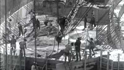 Workers directed it into
position. - Flood in the Desert