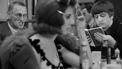 Would you look at him sitting there with his hooter scraping away at that book - A Hard Day's Night