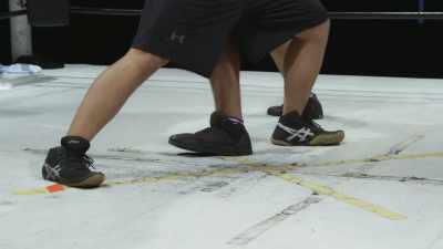 (wrestlers grunting) - The Wrestlers