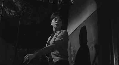 Yes? Who is it? - The L Shaped Room