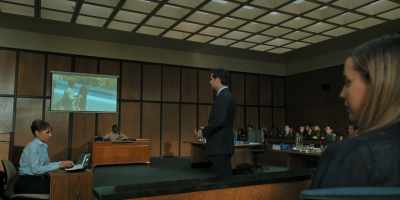 Yet his hands
are being cuffed behind, not in front. - The Lincoln Lawyer