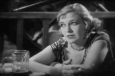 "You better take my tip -
an' stay away from that dame!" - The Docks of New York