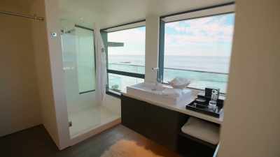 You can literally shower
while watching the waves crash. - Selling The OC