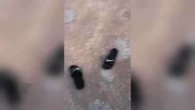 You couldn't really see 'em.
This is his flip-flops. - Never Seen Again