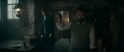You know what this is of courseNewt had it in ParisI can't say I have much experience with such thingsbut it looks to me to be a blood trothThat would be correctAnd whose blood is contained withinMineAnd Grindelwald'sI'm assuming that's why you can't move - Fantastic Beasts: The Secrets of Dumbledore
