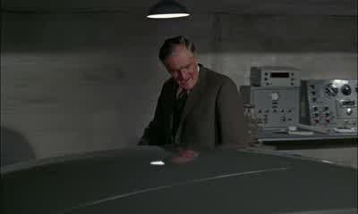 You see this arm hereNow open the top and inside are your defence mechanism controlsSmoke screen Oil slickRear bulletproof screenAnd left and right front wing machine gunsNow this one I'm particularly keen about You see the gear lever hereNow if you take - Goldfinger