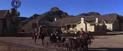 You two go ahead. I'll
ride up and fetch him. - Chisum