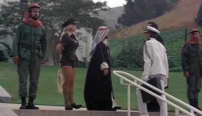 Your presence is a credit to low
majalleni, Dr. Kaiser. - Ilsa, Harem Keeper of the Oil Sheiks
