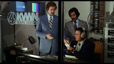 You're watching Channel 4 News with five-time Emmy award-winning anchor Ron Burgundy and Tits McGee. - Anchorman: The Legend of Ron Burgundy