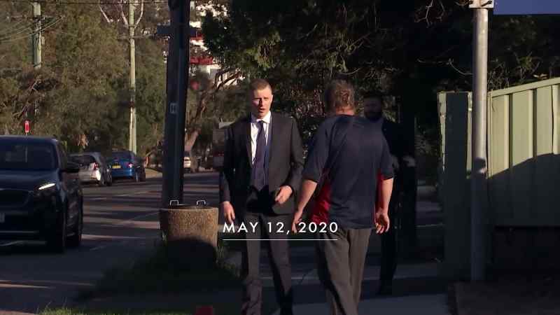 A 49-year-old man led away in handcuffs