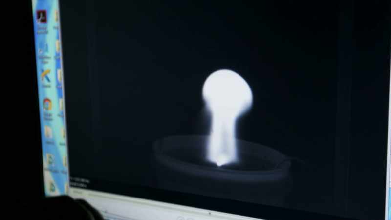 A BALL THAT RISES UP AND AWAY FROM THAT CENTRAL ELECTRODE