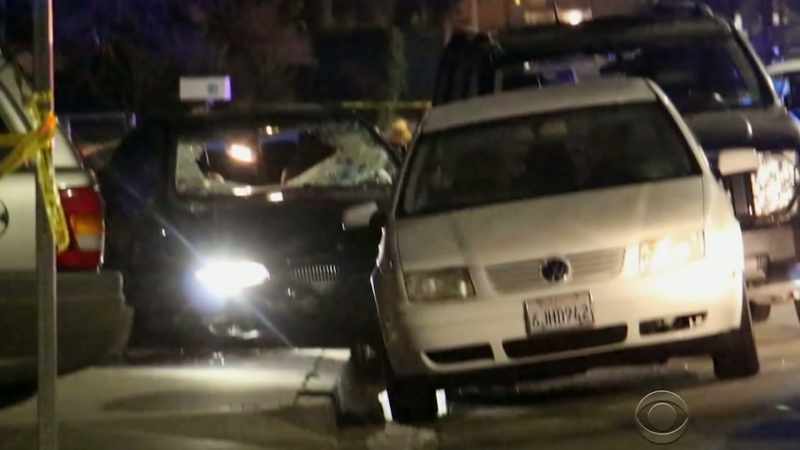 A black car pulls up and stops