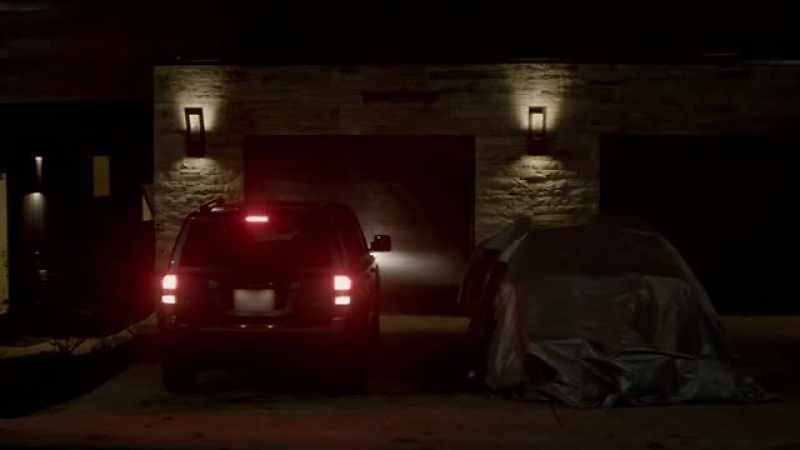 A car under a tarp