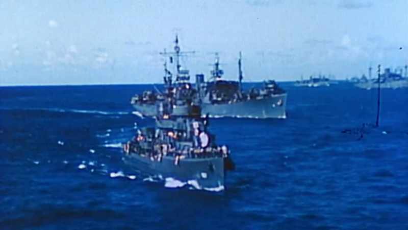 A full-scale invasion force cuts through the open sea
