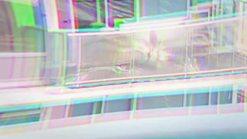 �A ginger tomcat has strayed onto a neighboring balcony