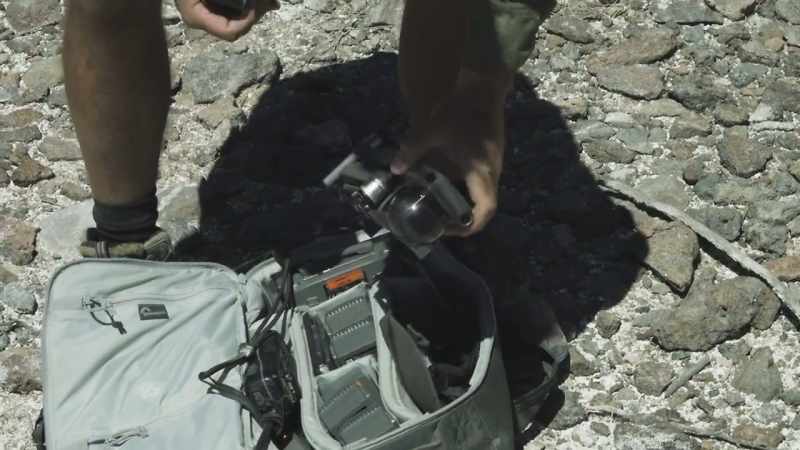 A gusting wind isn't helping the drone crew, either