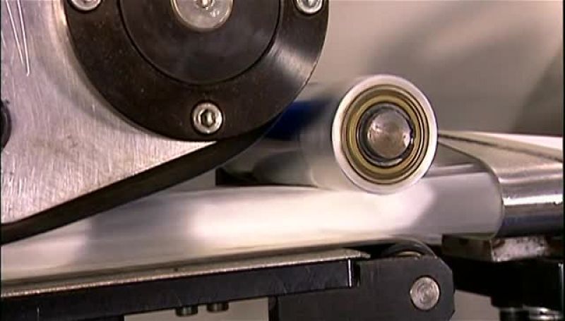 A HOT, IRON-LIKE DEVICE, CALLED AN EMBOSSING PRESS