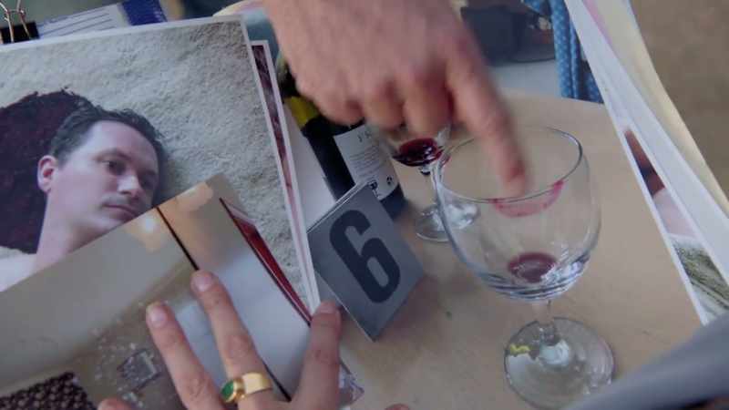 A lipstick smear on a wine glass