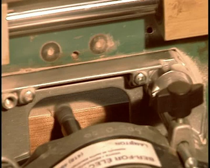 A MACHINE PREPARES THE DOOR FOR HINGES