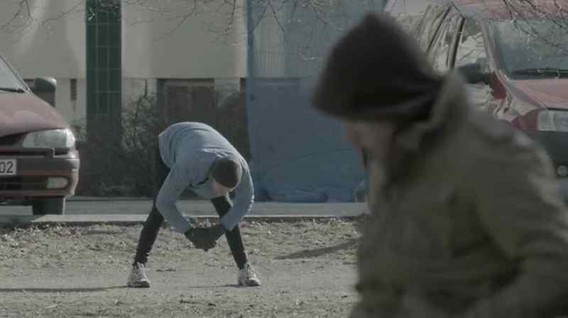 A man with a dog approaching the object