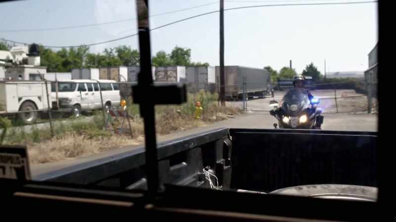 A motorcycle cop pulled right up on the side of the car